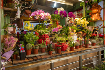 A flower shop located in Dongsanshui Street Market, offering a vibrant array of blooms and greenery.