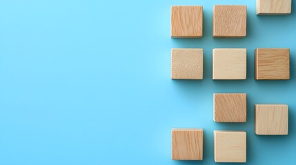 Wooden blocks arranged on a light blue background