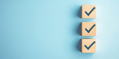 Three wooden blocks with a blue check mark on them