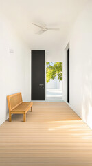 Obraz premium Modern hallway features simple bench and natural light from large windows