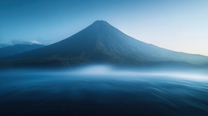 Towering green mountain peak with dense pine forest
