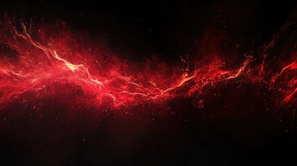 Red powder explosion creating dynamic abstract patterns against a dark background showcasing energy and movement in vibrant colors