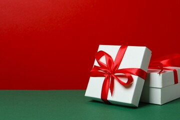 Beautiful gift boxes on color background 