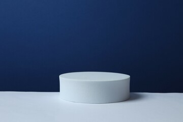 White podium on color background 