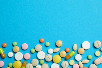 Various pills on color background