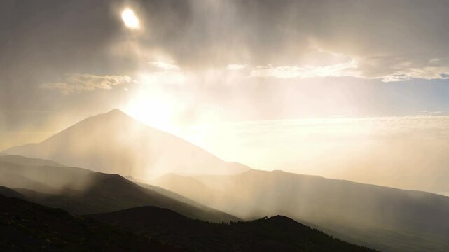 Hyperlapse footage of the heavy rain pouring over a mountain range during a rainstorm at sunset