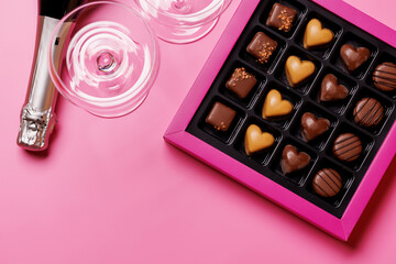 A glasses of champagne elegantly paired with a box of rich chocolates