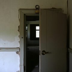 Entrance door in an old abandoned house with lock