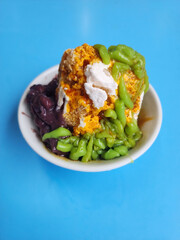 Cendol is a Malaysian dessert made of shaved ice, coconut milk, green pandan jelly noodles, and sweet dark brown sugar syrup. 
