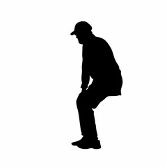 A man is wearing a backpack and a hat