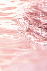 A pink water wave with a pink background. The water is calm and peaceful. The pink color of the water and background creates a serene and calming atmosphere