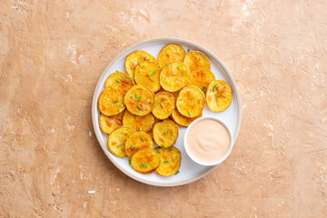 Baked potatoes with sauce. Homemade chips. Appetizer. Snack. Vegetarian food.