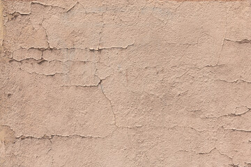 Earthy brown toned grunge wall background texture for textured stone backdrop for ad space or copy space