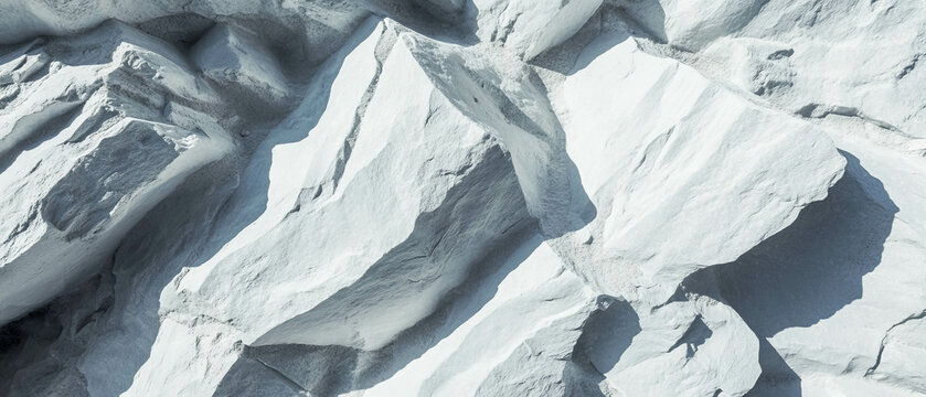 Textured light gray stone surface with cool and smooth appearance on a neutral background