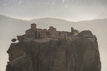 Sunset over Meteora. Amazing landscape of Monastery of the Holy Trinity from Meteora, iconic place for Greek people and orthodox around the world.