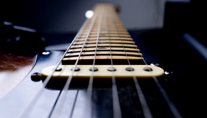 Close-up of an electric guitar's fretboard and strings, showcasing details and craftsmanship. Ideal for music-related projects, highlighting the beauty and precision of musical instruments.