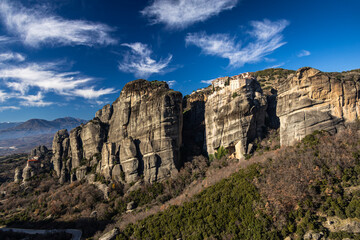 The mountains of Meteora. Amazing landscape with the cliffs and rocks from Meteora during a day with blue wky and spectacular clouds. Travel to Greece.