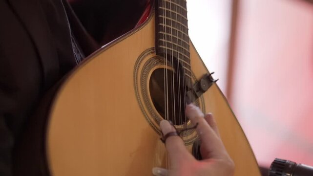 Portuguese guitar being played, central to the soulful essence of Fado music