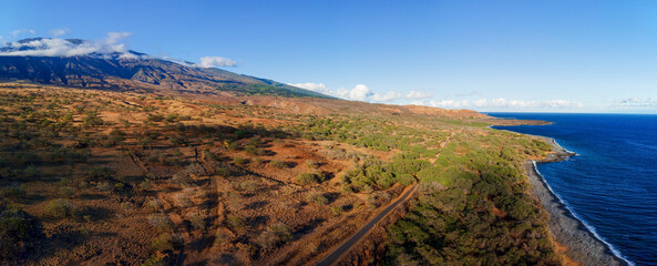Fototapeta premium A road trip along the Maui South Piilani Highway during golden sunset hour