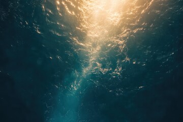 Fototapeta premium Golden Sunlight Illuminates Deep Ocean Waters