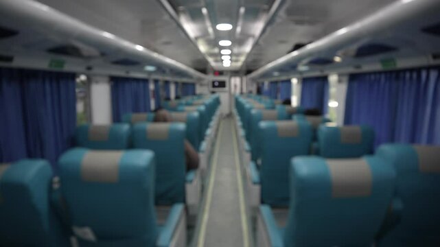 Blurred background Empty seats on a passenger train in Indonesia at night.