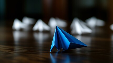 Blue Origami Airplane Leading the Pack: A Metaphor for Innovation and Standing Out