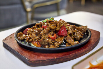 Chinese meat dish in a Chinese restaurant close-up