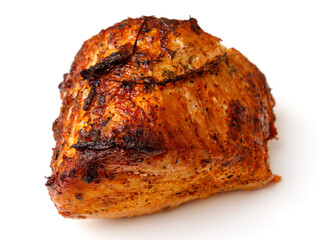 A piece of meat is covered in spices and appears to be cooked