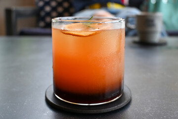 glass of orange juice with ice