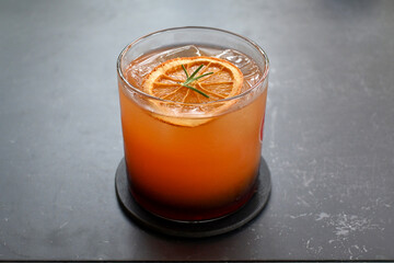 glass of orange juice with ice