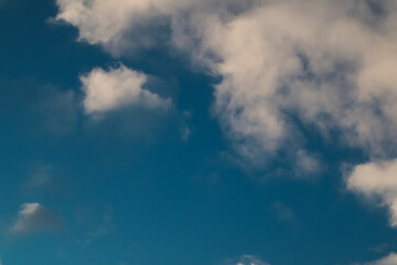 Winter blue sky and cloud. Calm clear winter air background. The sky blue texture clouds. Blue sky and White cloud nature background.
