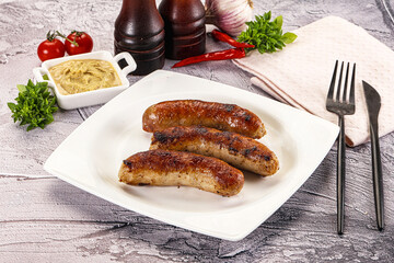 Delicous natural roasted sausages in the plate