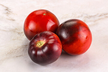 Black ripe juicy organic tomato