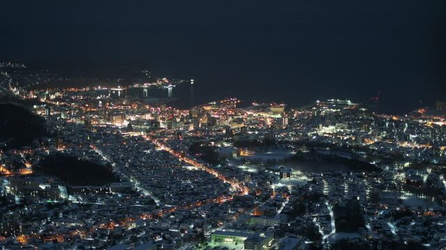 Japanese city street lights and winter snowing weather