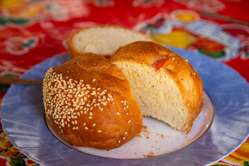 Oaxacan egg yolk bread decorated with alfeñique figures for the Day of the Dead.