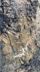 Different kinds of stone, metal structures near a sea in mumbai.