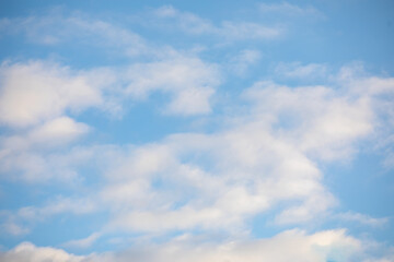Obraz premium Light Clouds on a Sunny Blue Sky - Perfect for Sky Replacement or Nature Backgrounds