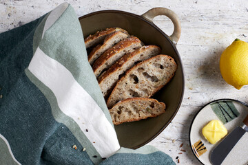 homemade sourdough bread, slices in a bowl on table at breakfast