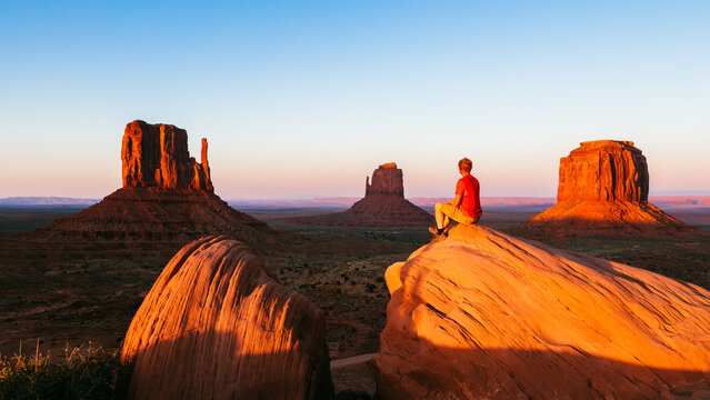 Man enjoying sunset over the Monument Valley, Arizona, United States