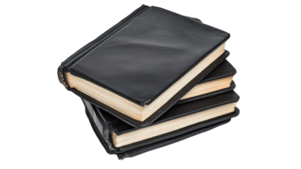 Stack of three black hardcover books isolated on a black background.
