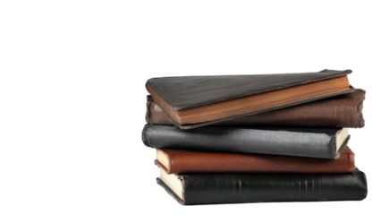 Stack of vintage books with leather covers on a black background.