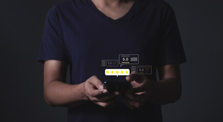Customer Review, Young Man hand using smartphone mobile with five star to review and give 5 stars...