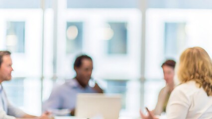 Fototapeta premium Corporate Meeting in Progress: Depicts a business meeting with participants engaged in discussion, set against a blurred conference room backdrop. 