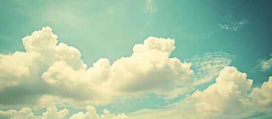 Beautiful vintage toned blue sky with white clouds ideal for background and wallpaper A natural and inspirational theme. with copy space image. Place for adding text or design