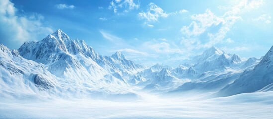 Snowy mountains and snow covered fields against a blue sky. with copy space image. Place for adding text or design