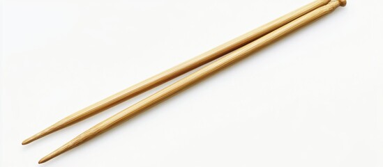 Close up of two size six knitting needles set against a white background. with copy space image. Place for adding text or design