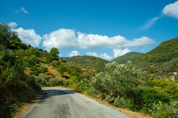 View of the sea, mountains, rocks, beaches, islands and the sky from different sides of the Skopelos island Greece.