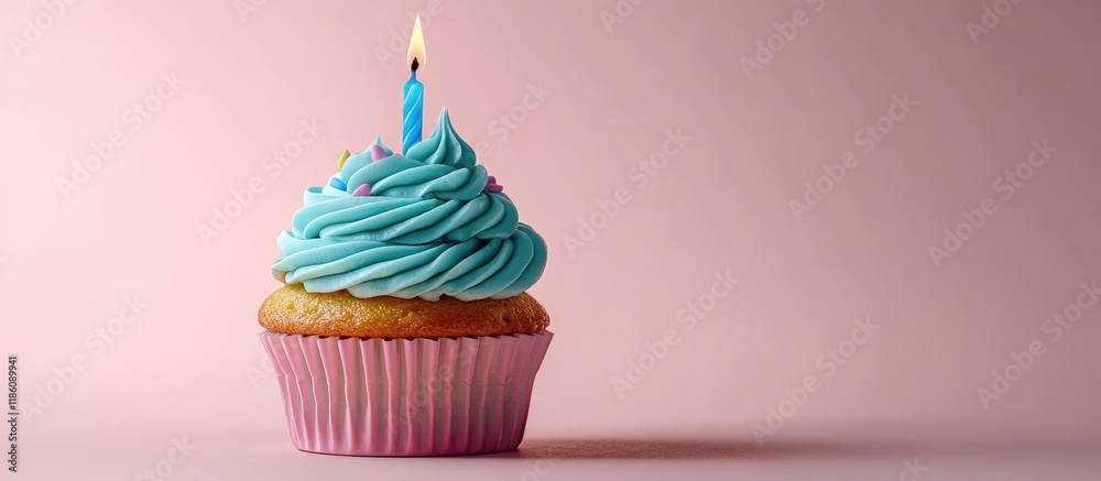 Poster tasty birthday cupcake topped with turquoise cream and a lit candle set against a pink background ro