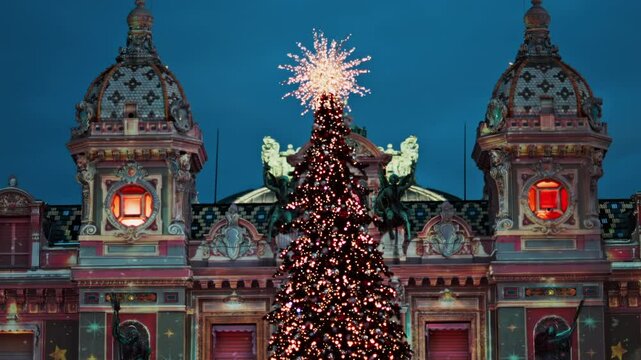 Lighted Christmas tree in front of the Monte Carlo Casino in the evening