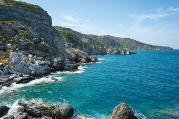 View of the sea, mountains, rocks, beaches, islands and the sky from different sides of the Skopelos island Greece.